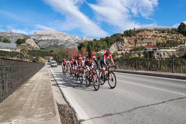 cyclists going up hill preparing for season sports catering in Javea